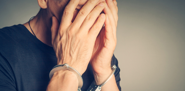 male hands in handcuffs