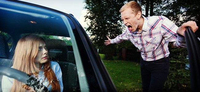 man yelling at female driver